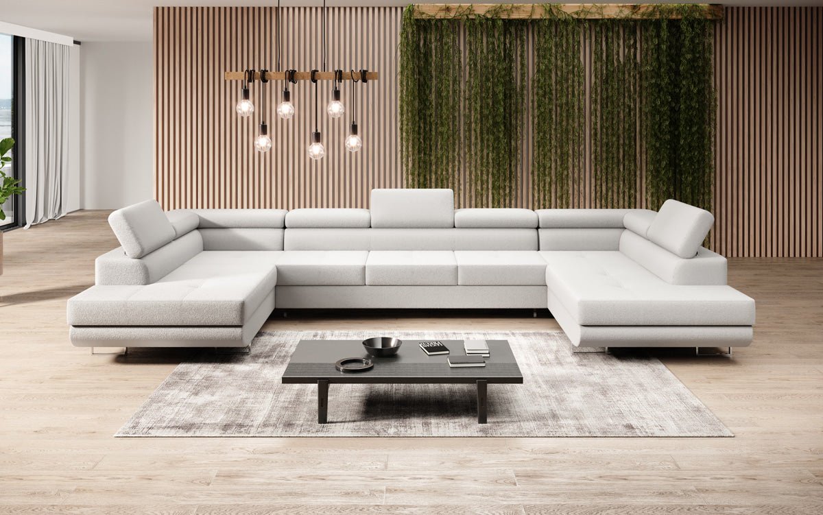 Projektowana sofa Taormina z funkcją spania i składania w bouclé