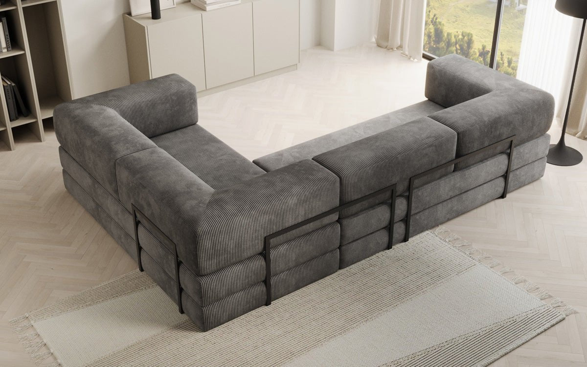 Sofa projektanta Lazy L obita materiałem Cord