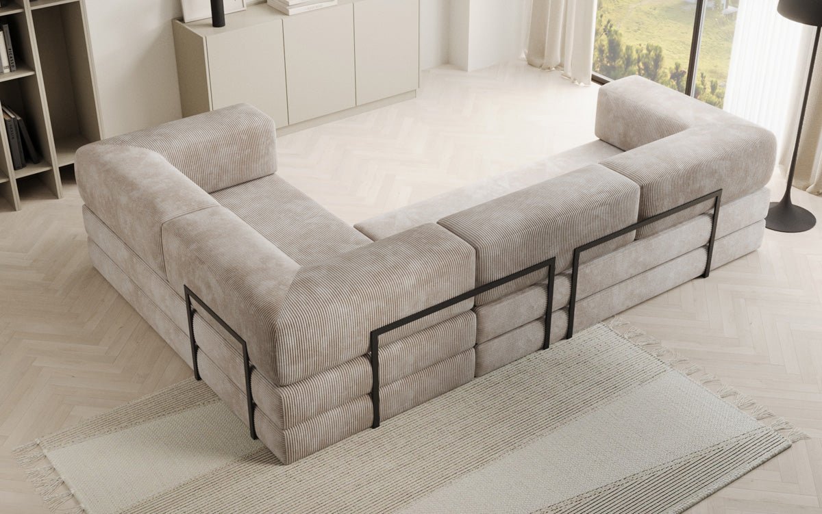 Sofa projektanta Lazy L obita materiałem Cord